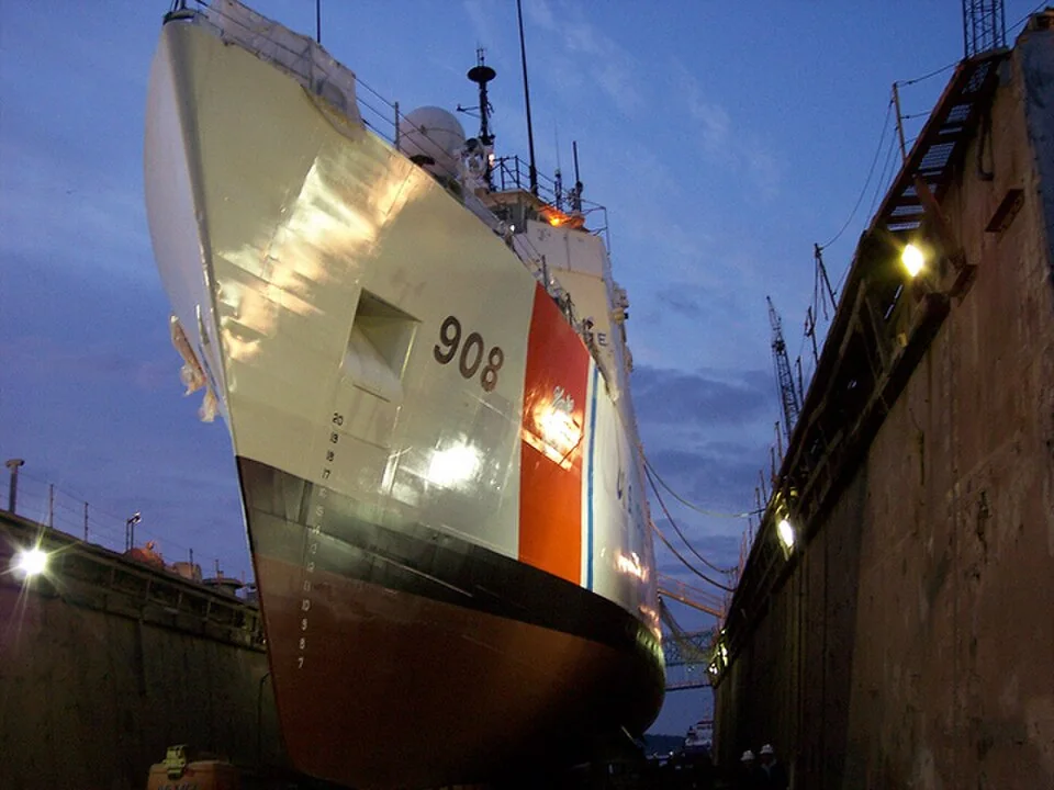 Ship undergoing maintenance in a dry dock